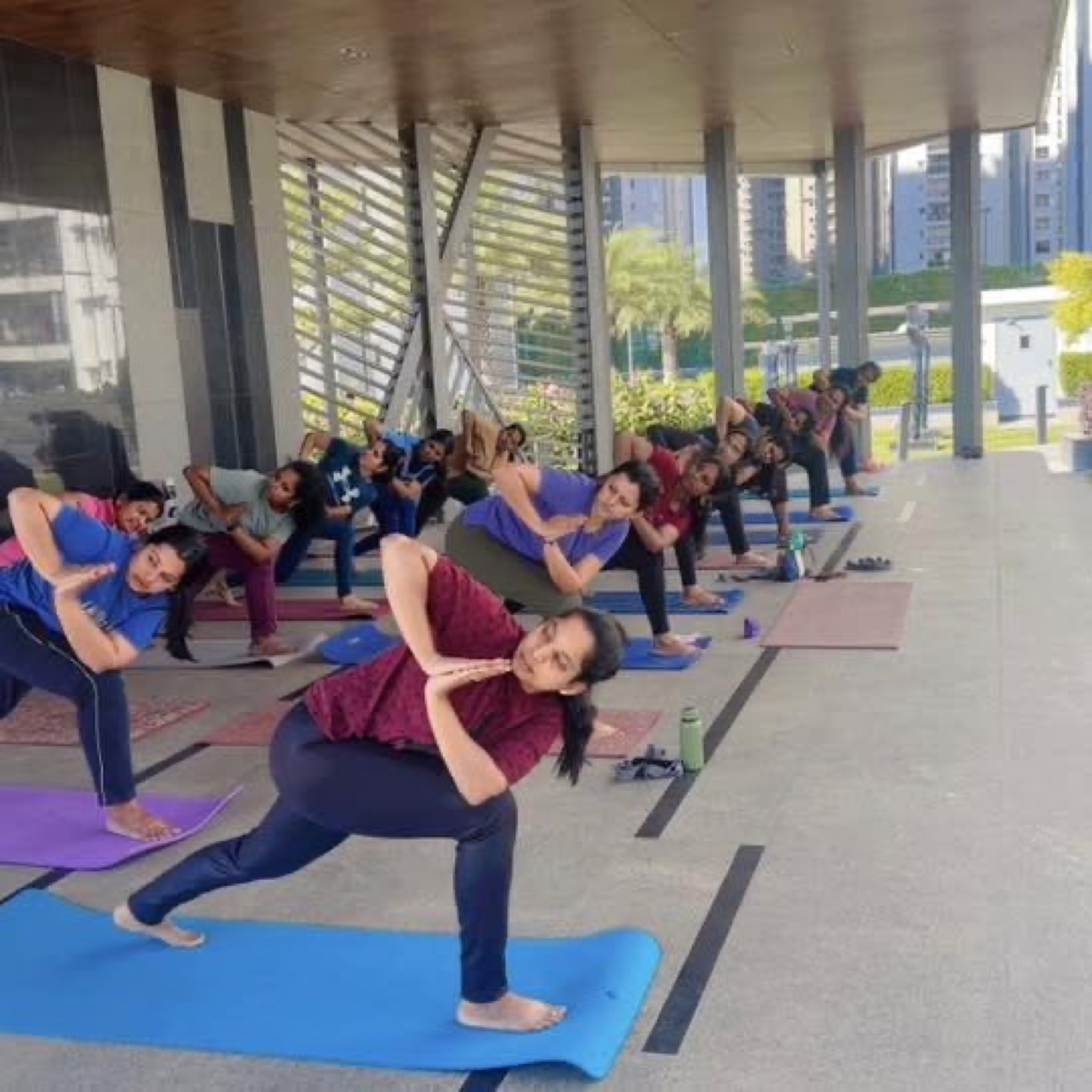 A student in a deep warrior lunge